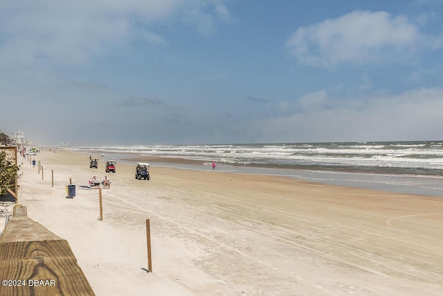 view of community featuring a water view and a view of the beach