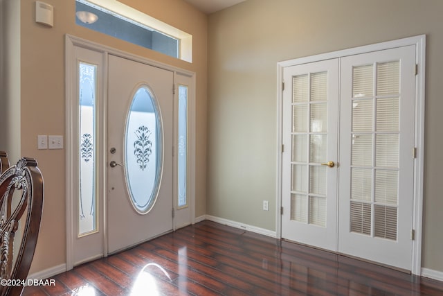 foyer entrance with dark hardwood / wood-style floors