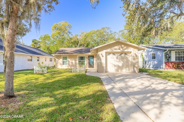 single story home featuring a garage and a front yard