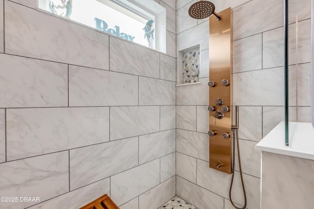 bathroom with a tile shower