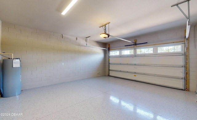 garage with a garage door opener and gas water heater