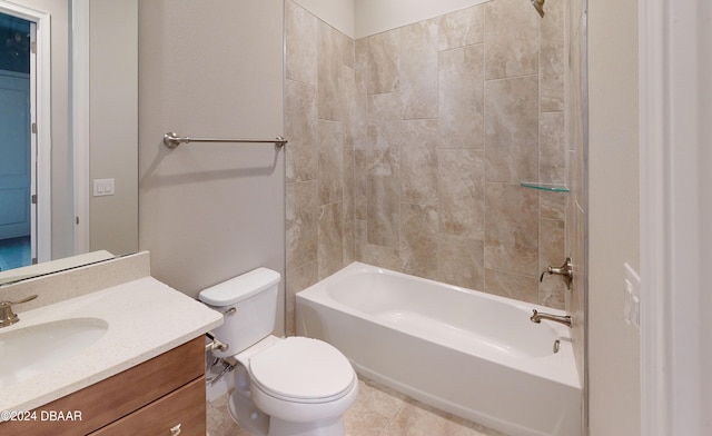 full bathroom with tile patterned flooring, vanity, toilet, and tiled shower / bath