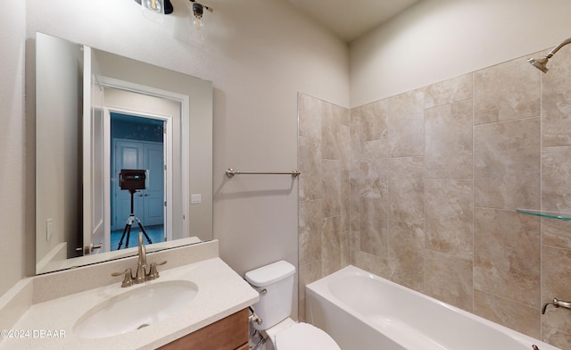 full bathroom featuring vanity, toilet, and tiled shower / bath combo