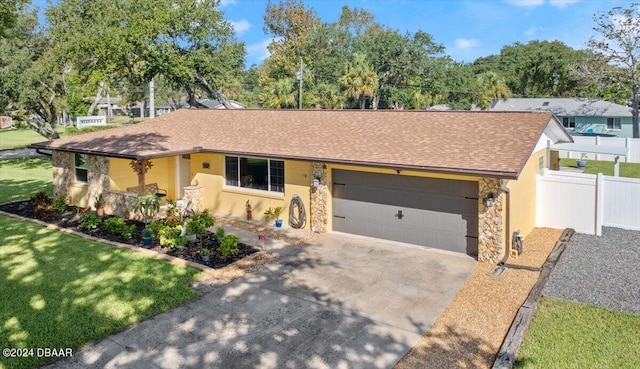 view of front facade featuring a garage and a front yard