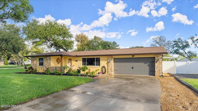 ranch-style house featuring a garage and a front yard