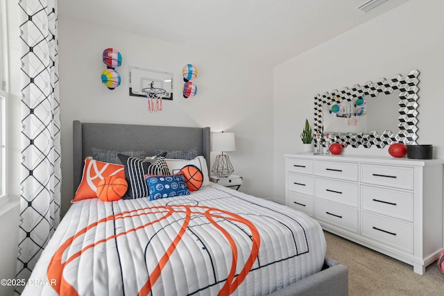 bedroom with light colored carpet