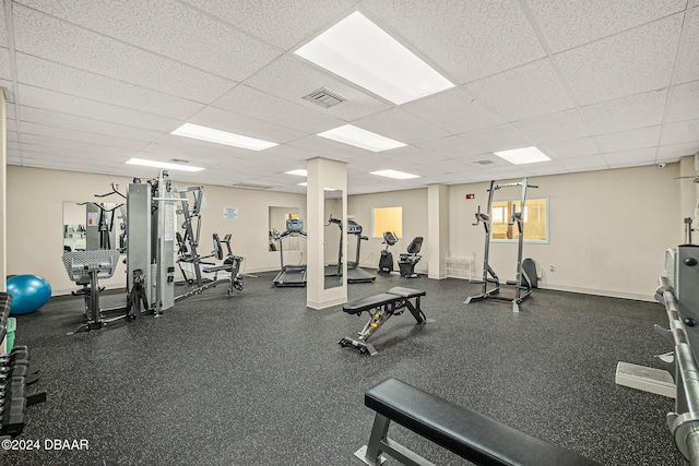 exercise room featuring a paneled ceiling