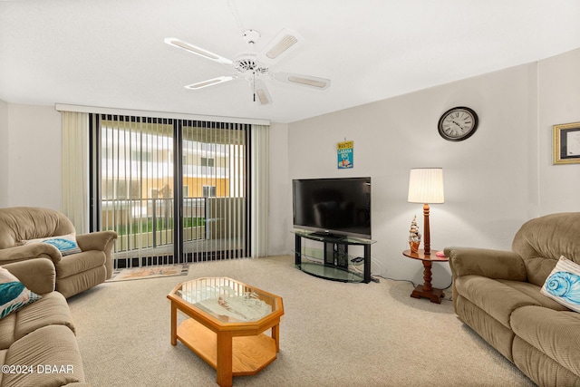 carpeted living room with ceiling fan