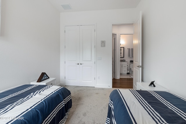 bedroom with carpet floors and a closet