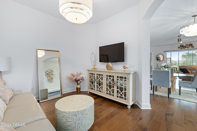 living room with dark hardwood / wood-style flooring