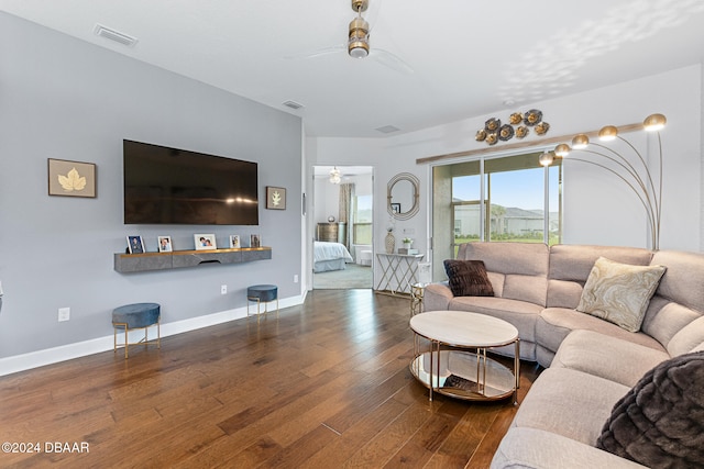 living room featuring ceiling fan and hardwood / wood-style flooring