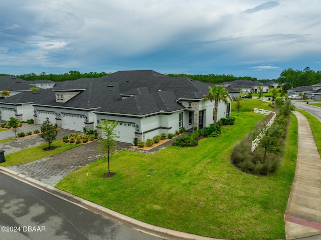 view of home's exterior featuring a lawn and a garage