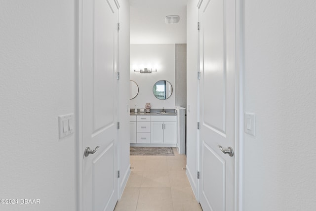 bathroom with tile patterned flooring and vanity