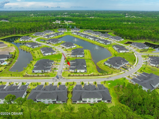 drone / aerial view with a water view