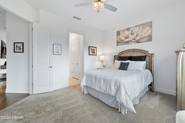 carpeted bedroom with ceiling fan