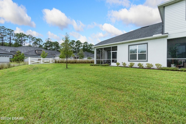 view of yard with a sunroom