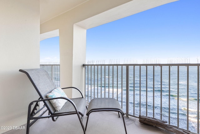 balcony featuring a water view