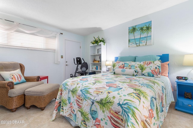 bedroom featuring light tile patterned floors