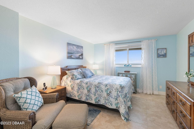 bedroom featuring a textured ceiling