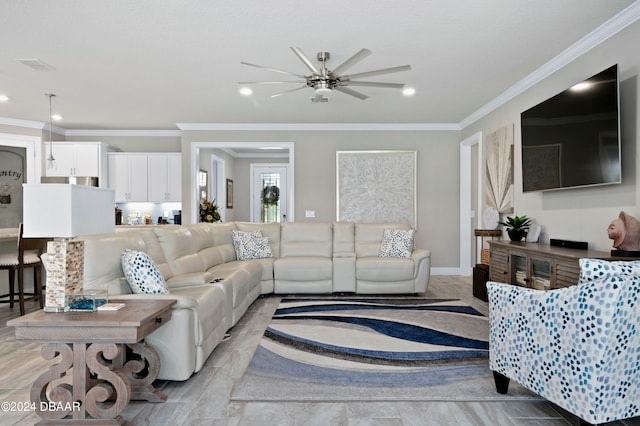 living room with ceiling fan and crown molding