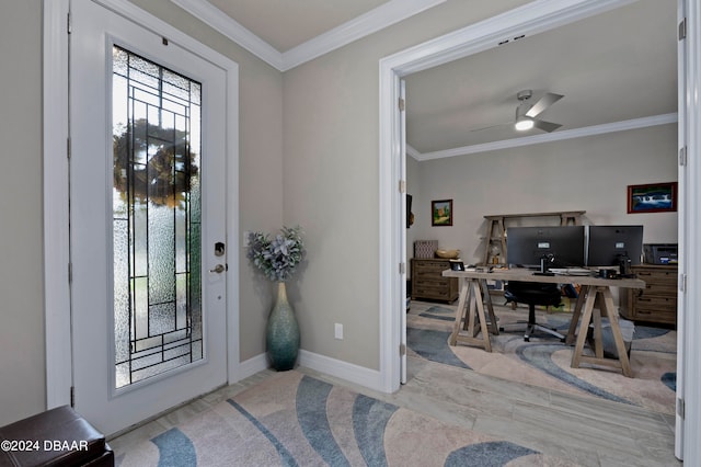 entrance foyer with ceiling fan and ornamental molding