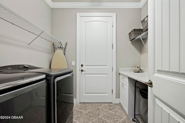 washroom with crown molding and washer and dryer