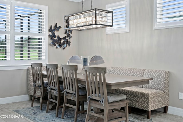 dining room featuring a chandelier and a wealth of natural light