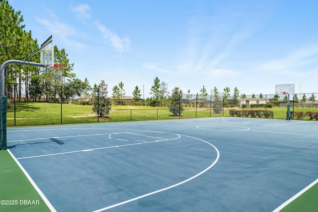 view of basketball court featuring a lawn