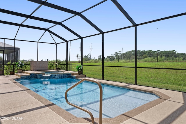 view of pool with a lanai, an in ground hot tub, and a yard