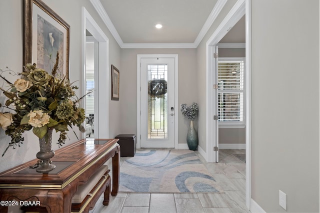 entrance foyer featuring light tile patterned floors and ornamental molding