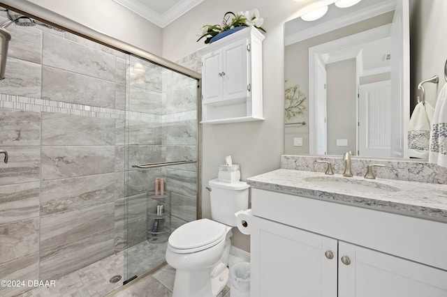 bathroom with vanity, toilet, a shower with door, and ornamental molding