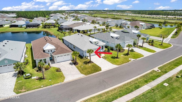 birds eye view of property featuring a water view