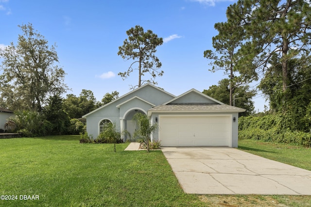 ranch-style home with a front lawn and a garage