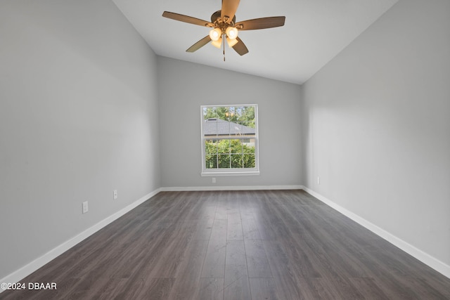 unfurnished room featuring dark wood-type flooring, ceiling fan, and vaulted ceiling