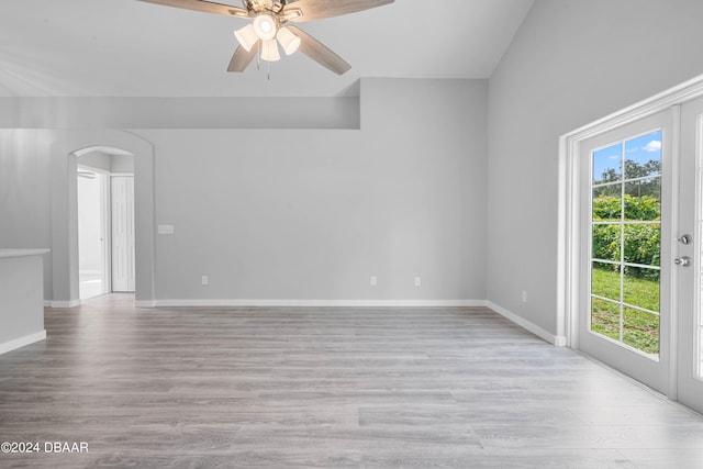 spare room with ceiling fan, plenty of natural light, and light hardwood / wood-style flooring