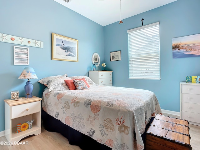 bedroom with light wood-type flooring