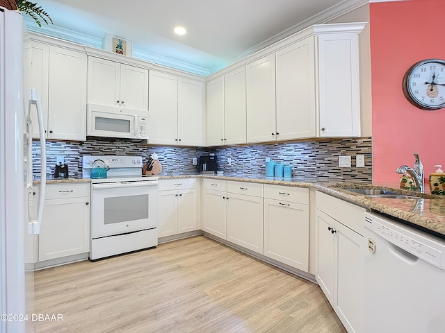 310 Coral Reef Way, Daytona Beach, FL 32124 - kitchen with light stone counters, white appliances, a sink, white cabinetry, and light wood finished floors
