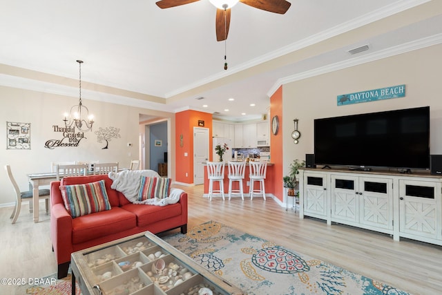310 Coral Reef Way, Daytona Beach, FL 32124 - living room with light wood-type flooring, baseboards, visible vents, and ornamental molding