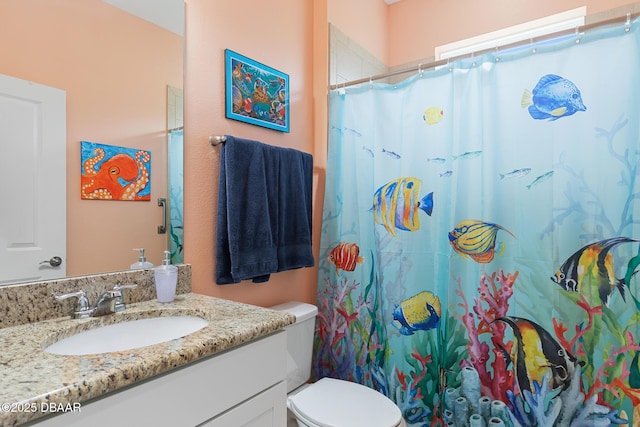 310 Coral Reef Way, Daytona Beach, FL 32124 - bathroom featuring curtained shower, vanity, and toilet