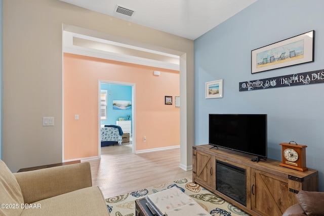310 Coral Reef Way, Daytona Beach, FL 32124 - living area with baseboards, visible vents, and light wood-style floors