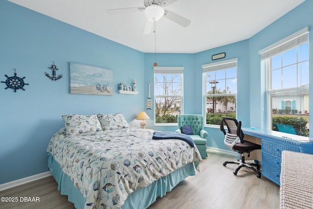 310 Coral Reef Way, Daytona Beach, FL 32124 - bedroom featuring a ceiling fan, baseboards, and wood finished floors