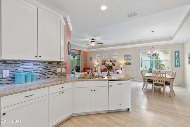 310 Coral Reef Way, Daytona Beach, FL 32124 - kitchen featuring visible vents, dishwasher, ornamental molding, a peninsula, and white cabinetry