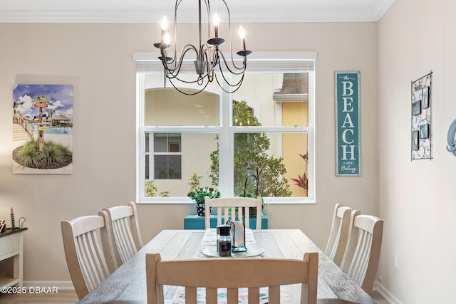 310 Coral Reef Way, Daytona Beach, FL 32124 - dining area with baseboards, a chandelier, and crown molding