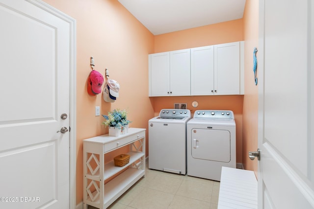 310 Coral Reef Way, Daytona Beach, FL 32124 - laundry area with washer and dryer, cabinet space, and light tile patterned floors