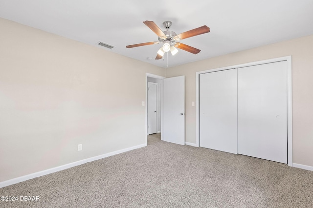 unfurnished bedroom featuring ceiling fan, carpet floors, and a closet