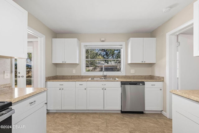 kitchen with white cabinets, stainless steel appliances, and sink