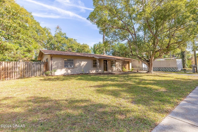 single story home with a front yard