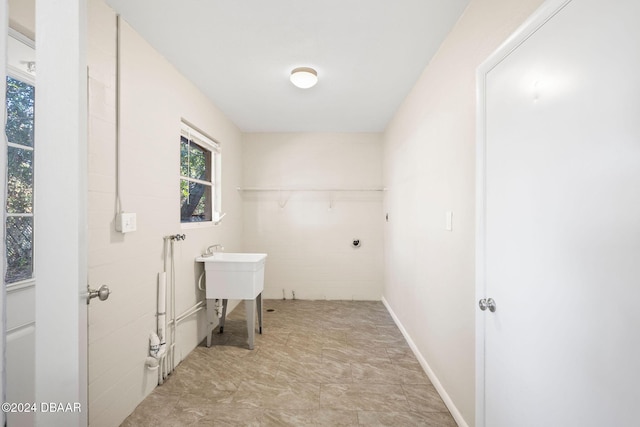 clothes washing area featuring hookup for an electric dryer