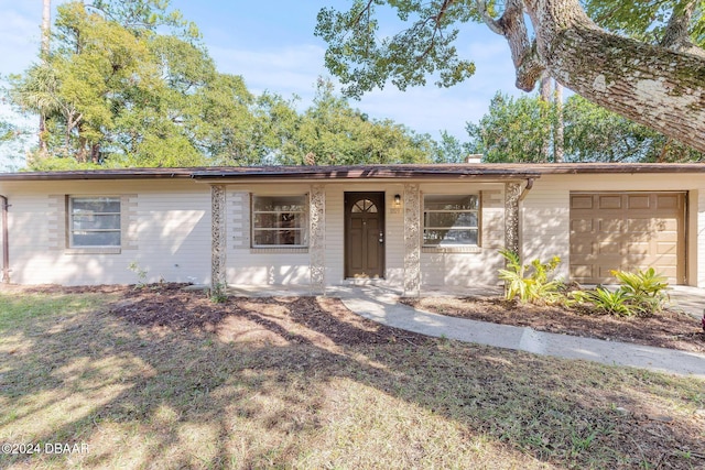 ranch-style home with a garage