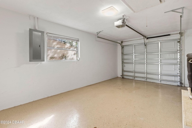 garage featuring electric panel and a garage door opener